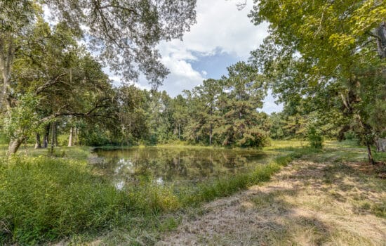 SOLD: 20 Unrestriced Acres with Metal Building and Pond in Hull, TX